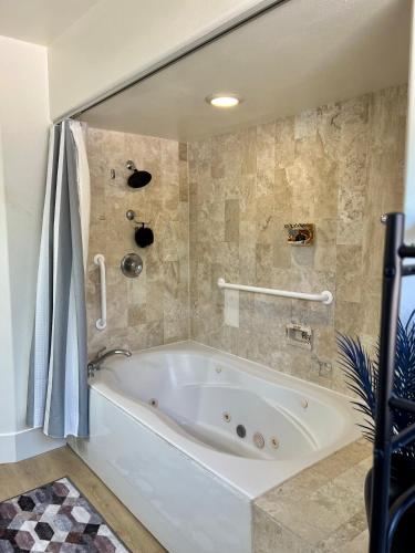 a white bath tub in a bathroom at St George Resort Condo in St. George