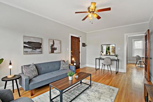 a living room with a couch and a ceiling fan at Vibrant 1BR Apartment close to Dining - Cullom B3 in Chicago