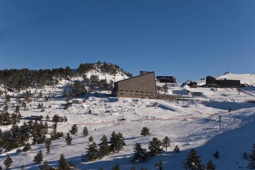 a building on top of a snow covered mountain at Kaya Palazzo Ski & Mountain Resort in Kartalkaya
