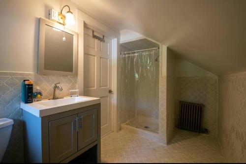 a bathroom with a sink and a shower at Incredible Ranch in the Woods - Lake View - Peace and Luxury! in Monroe