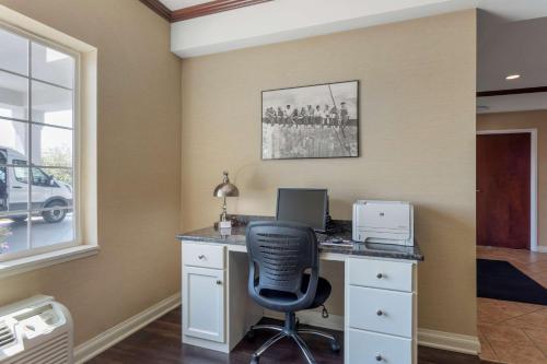 an office with a desk with a computer and a chair at Best Western Lawrenceburg Inn in Lawrenceburg