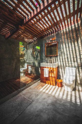 a bathroom with a sink and a toilet at Lush Atitlán in San Marcos La Laguna