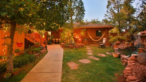 a yard with a house with a pathway at The Master Suite - MOST VISITED! in Sedona