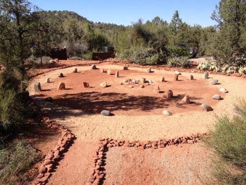 a group of rocks sitting in a dirt field at The Master Suite - MOST VISITED! in Sedona