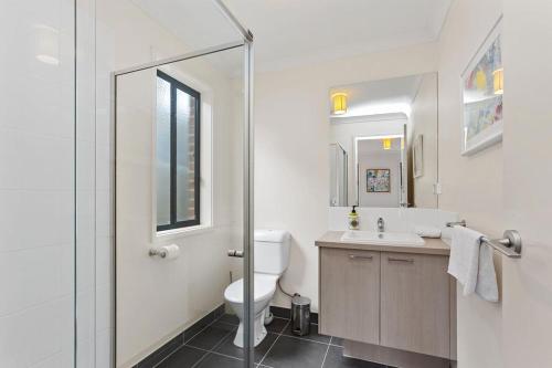 a bathroom with a toilet and a sink and a shower at The Summer House ~ 2 blocks to Beach in Apollo Bay