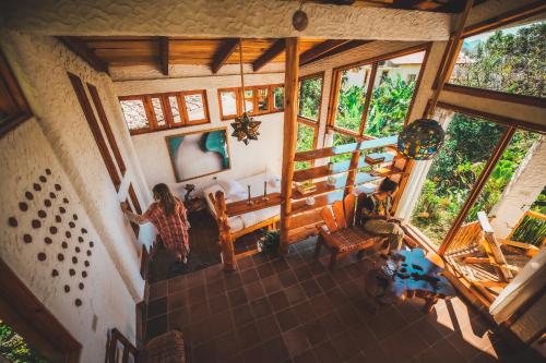 an overhead view of a woman in a living room at Lush Atitl&aacute;n in San Marcos La Laguna