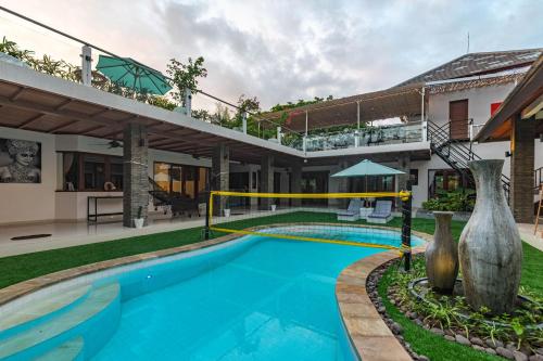a swimming pool in the backyard of a house at 5 BR Villa Sultan Luxury Entertainment and Relaxation in Seminyak