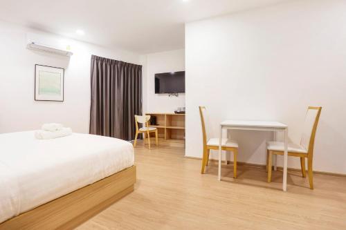 Letto o letti in una camera di TAKKA Hotel