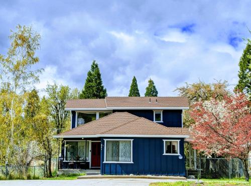 a blue house with a brown roof at 4 Elements House:Central, Views-Every Rm, AC, Pets in Mount Shasta