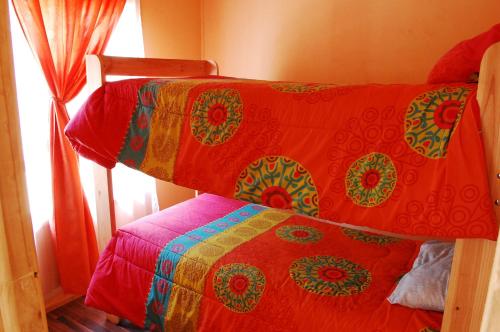 Postel nebo postele na pokoji v ubytování Hostal Doña Ema