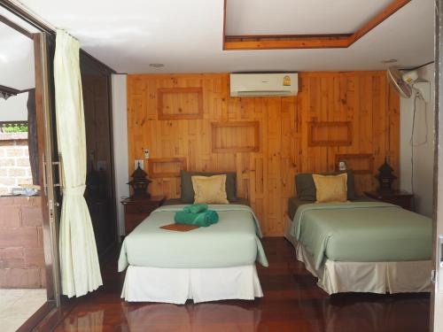 Postel nebo postele na pokoji v ubytování Koh Kood Beach Resort