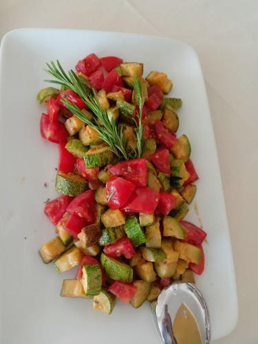 a plate of vegetables on a white plate at Hotel Ascot Riccione in Riccione