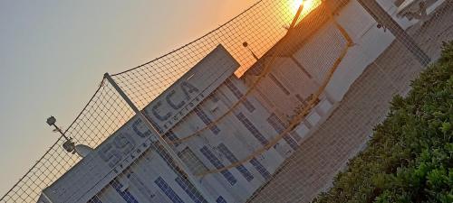 a fence with a light on top of a building at Hotel Ascot Riccione in Riccione