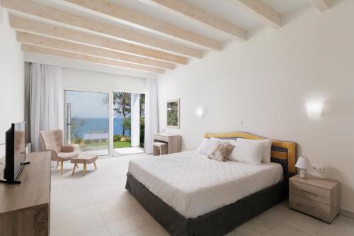 Postel nebo postele na pokoji v ubytování Nisos Villas Corfu