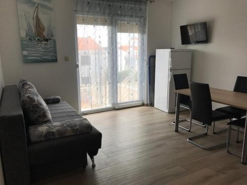 Posezení v ubytování Holiday apartment in Punat with terrace, air conditioning, WiFi, washing machine 4534-3