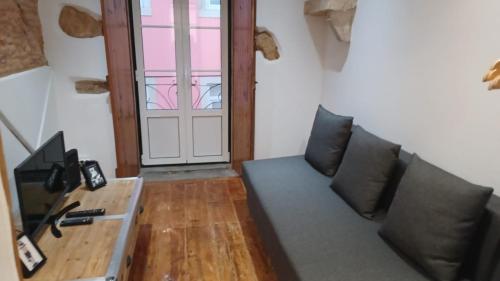 a living room with a couch and a table at Lisbon Rossio Typical Apartments in Lisbon