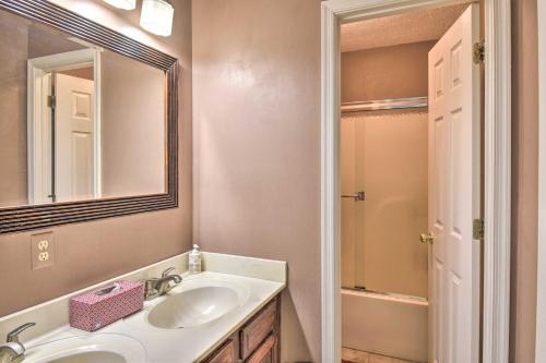 a bathroom with a sink and a mirror and a shower at Gloucester Retreat with Backyard Oasis and Pier! in Gloucester