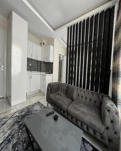 a living room with a couch and a table at Tower352 in Melikgazi