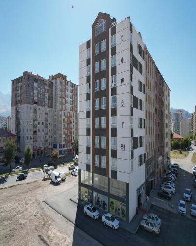 a rendering of a building with cars parked in a parking lot at Tower352 in Melikgazi