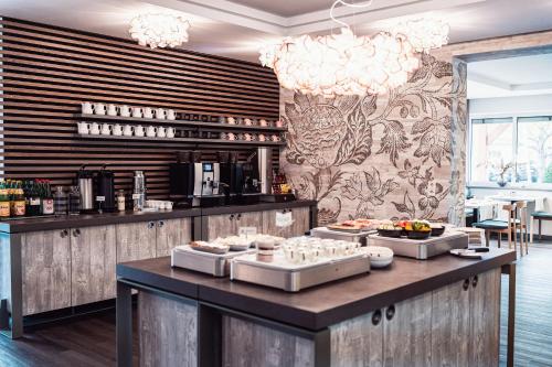 a buffet in a restaurant with several trays of food at Hotel Birkenhof in Bad Radkersburg