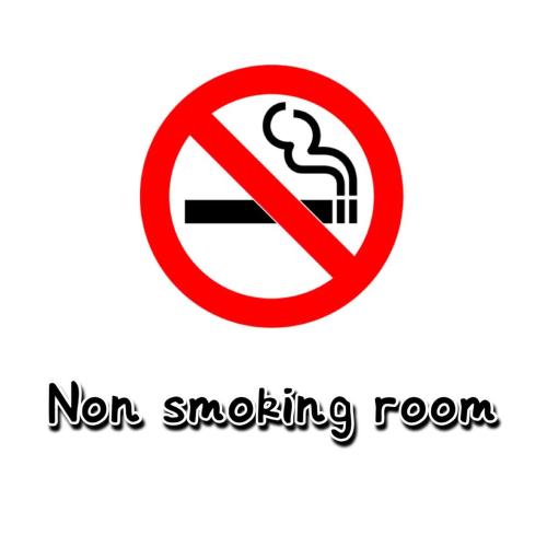 a no smoking sign isolated on a white background at Triang homestay 2 in Kampong Kerayong