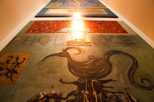 a painting of a rooster on a wall with a light at Bed & Breakfast Case Osti in Castel Maggiore