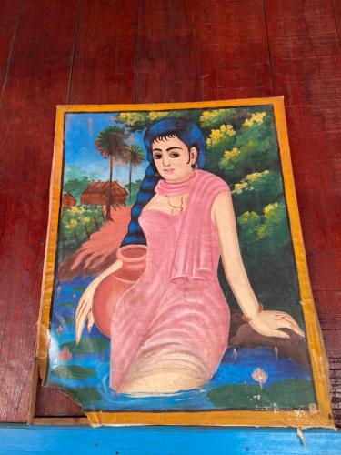 a picture of a painting of a woman at Sothea Angkor Homestay in Phumi Ta Phul