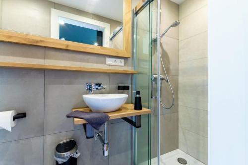 a bathroom with a sink and a shower at Chalet Coquette Vigny^Hadley in Saint-Michel-de-Maurienne