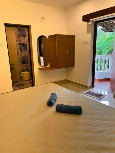 a bottle laying on a table in a room at TGI Guest Houses in Calangute