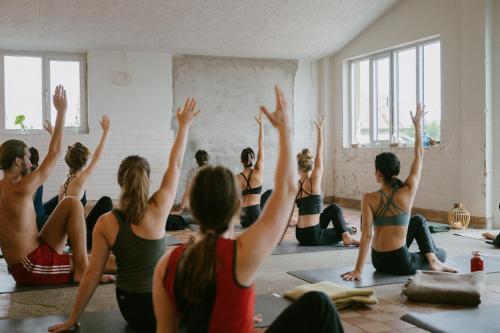 a group of people in a yoga class at Trevarefabrikken in Henningsvær