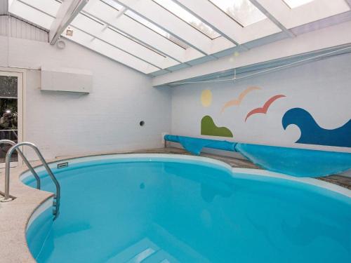 The swimming pool at or close to 8 person holiday home in rsted
