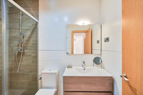 a bathroom with a toilet and a sink and a shower at PENTHOUSE NEAR MALAGA TOWN also long term and available car in Málaga