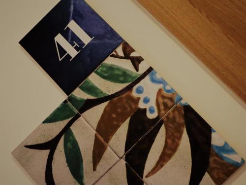 a picture of a painting of a dog at PATE'O Hostel & Suites in Ovar