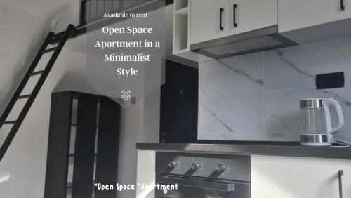 an open space appliance in a kitchen with a ladder at Open Space Apartment in Belgrade