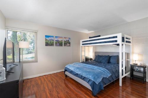 a bedroom with a bed with a bunk bed at Desert Paradise in Arcadia ~ Pool, Hot Tub, Views! in Phoenix