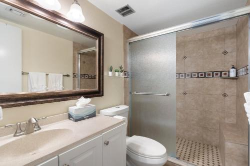 a bathroom with a shower and a toilet and a sink at Desert Paradise in Arcadia ~ Pool, Hot Tub, Views! in Phoenix