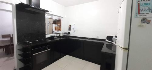A kitchen or kitchenette at Charme Caiçara