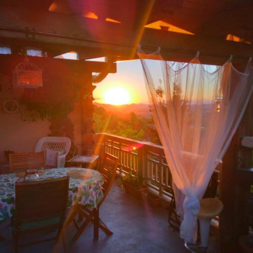 a view of the sunset from the balcony of a house at La Terrazza sul Monferrato in Ozzano Monferrato