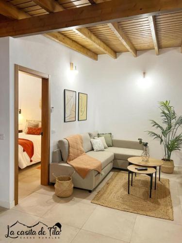 a living room with a couch and a table at La Casita de Tila in Ifonche