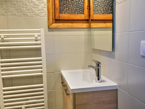 a bathroom with a sink and a mirror at Chalet Morzine, 3 pièces, 5 personnes - FR-1-524-93 in Morzine