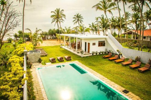 an aerial view of a house with a swimming pool at Infinity of Sri Lanka in Paiyagala South