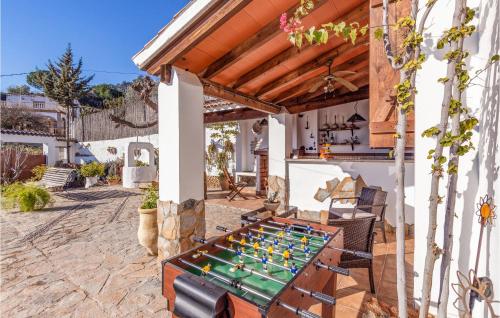 a house with a pool table on a patio at Stunning Home In Iznajar With Wifi in Iznájar