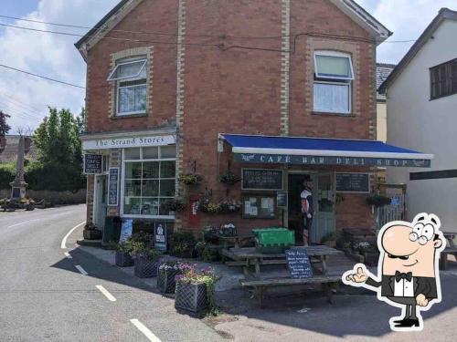 a building with a cartoon character in front of a store at The Loft - beautiful countryside apartment in Cullompton