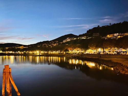 a view of a body of water at night at Alele Alloggio turistico in Trevignano Romano