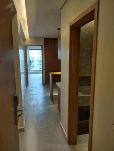 a hallway with a door to a room at Salinas Premium Resort in Salinópolis