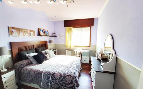 Katil atau katil-katil dalam bilik di Piso en Bueu a 100 metros de la playa