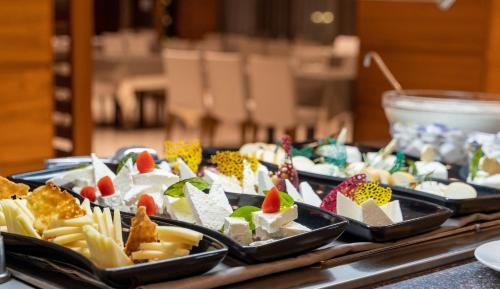 a buffet of different types of food on a table at Interhotel Sandanski in Sandanski
