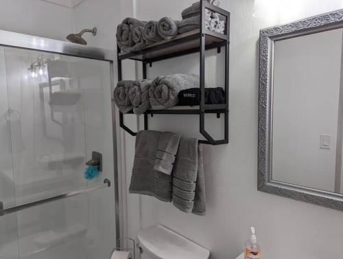 a bathroom with a towel rack next to a shower at Captains Hideaway in Salem
