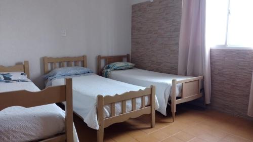 Ein Bett oder Betten in einem Zimmer der Unterkunft Hotel Atlantic