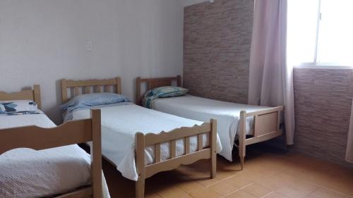 Postel nebo postele na pokoji v ubytování Hotel Atlantic
